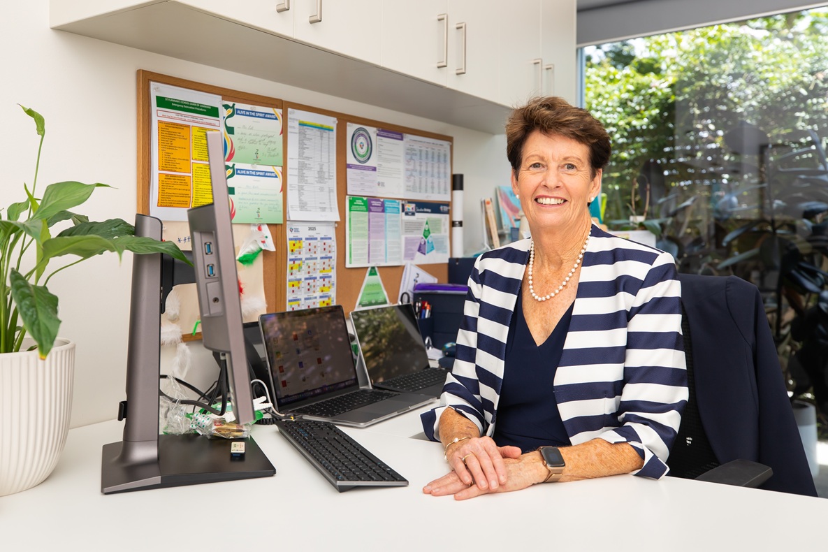 Principal sitting at her desk