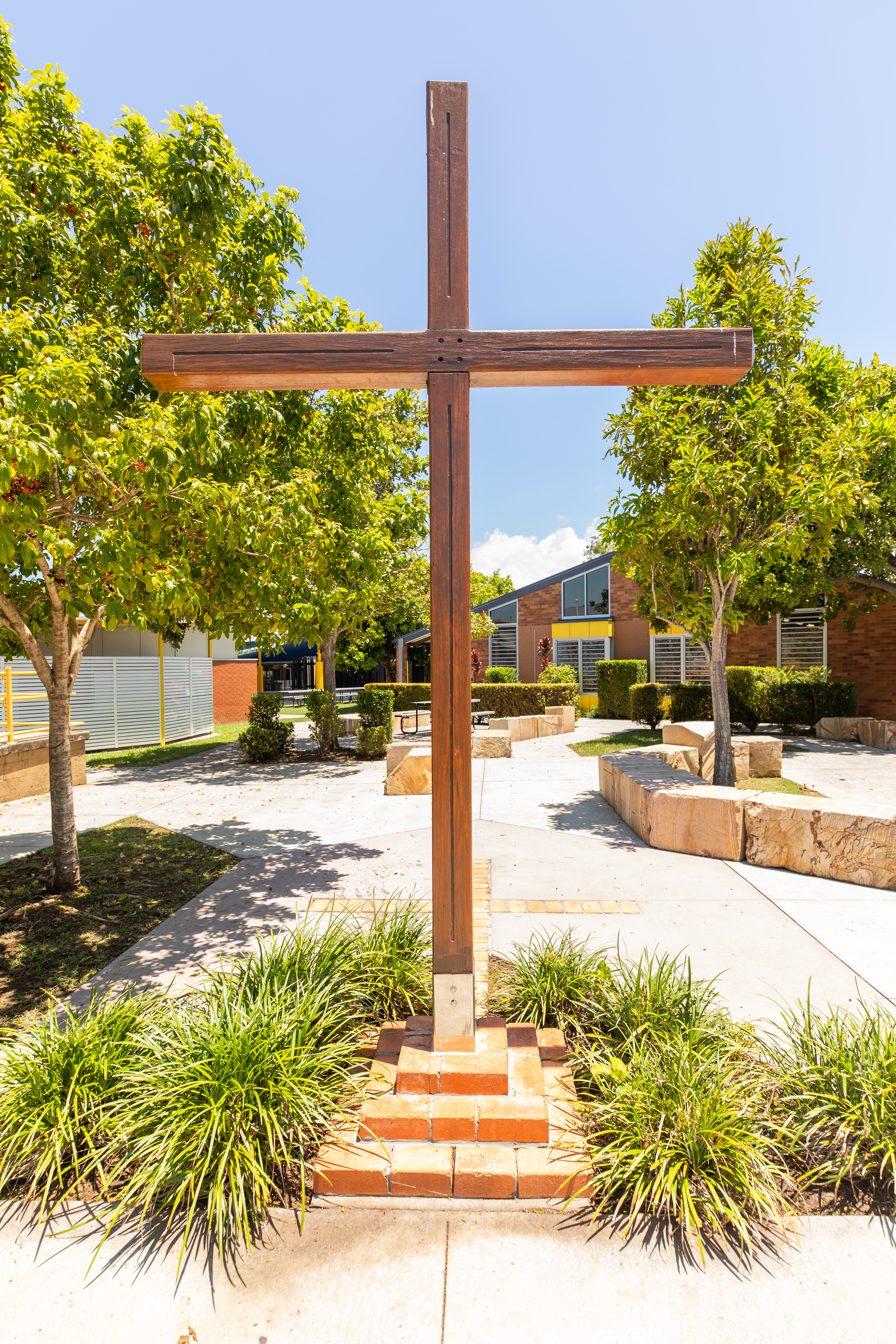 large wooden cross in school grounds